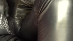 Leather catsuit playing tenderly on the skin