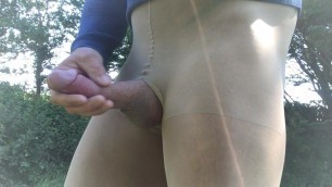 Outdoor cumshot in tan pantyhose .