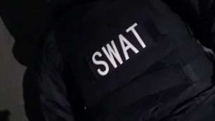 SWAT Soldier plays with his guns