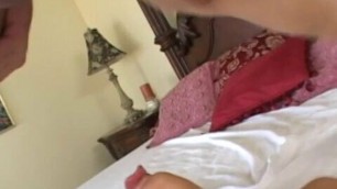 Submissive Asian whore sucks cock on the floor next to bed